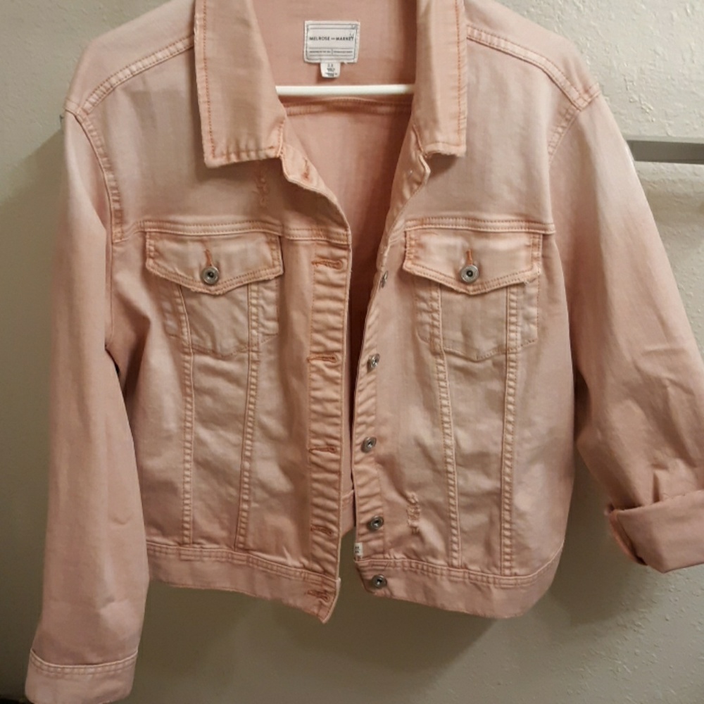 Distressed denim jacket.